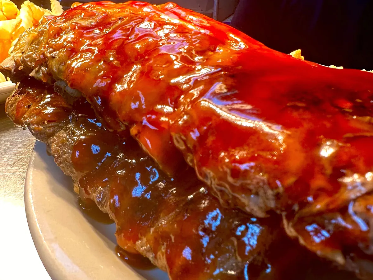 Marcy’s baby back ribs glistening with house-made BBQ sauce